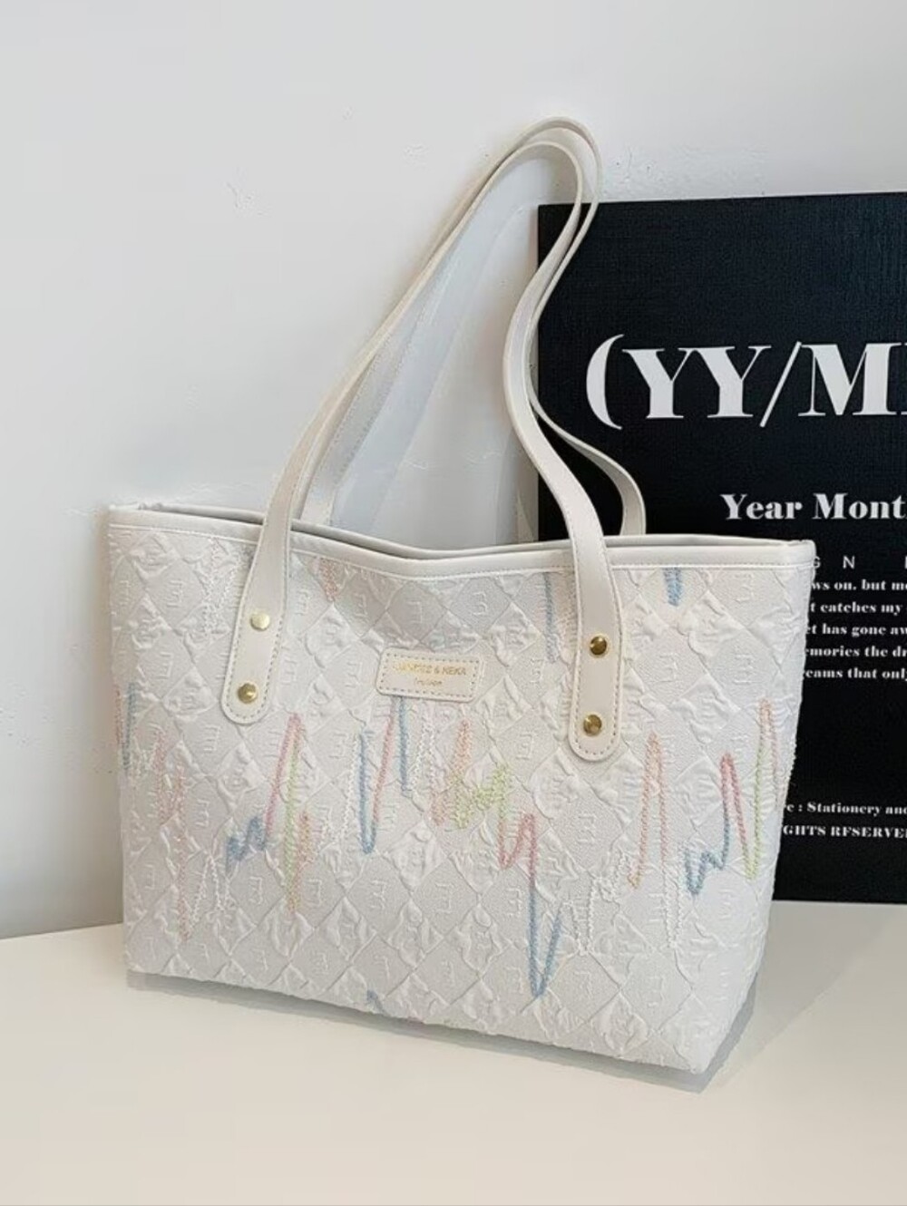 White Embossed Tote Bag with Pastel Accents - Designer Style